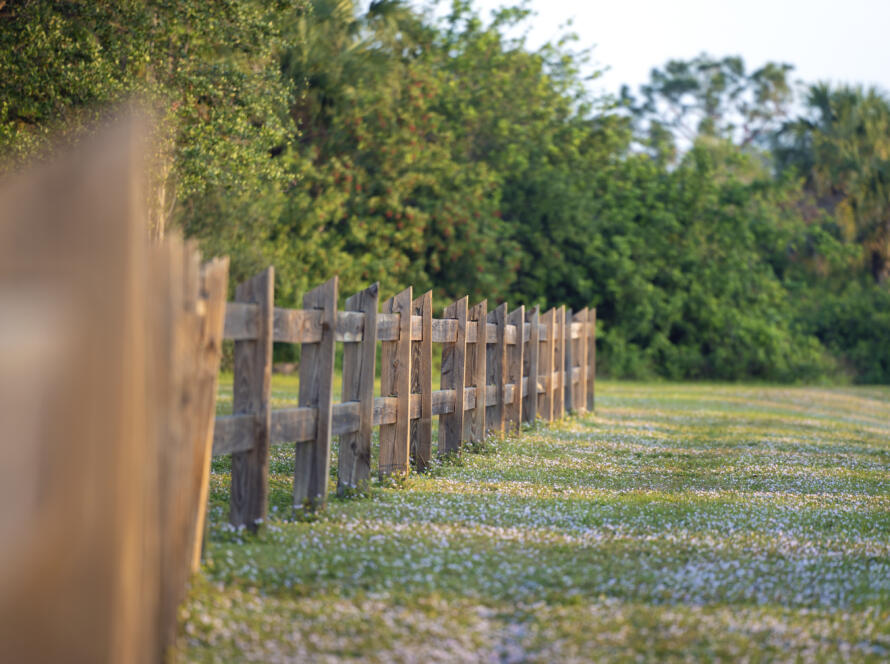 fenced off property, representing what is included in land surveying services