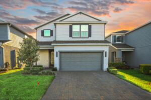 house with garage, highlighting the importance of a certified land surveyor