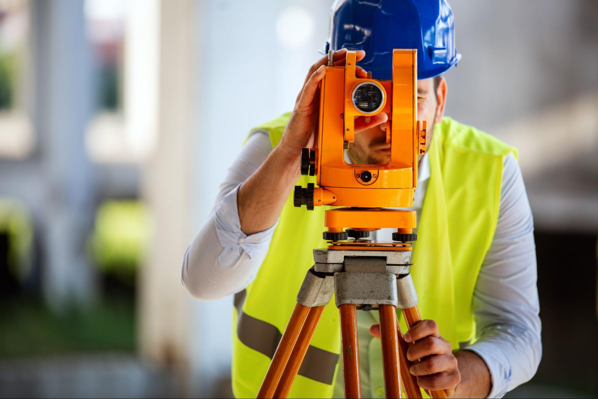 man performing land surveying services