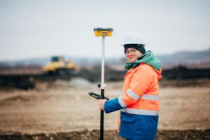 Surveyor using GPS equipment, representing Southpoint Geodetics Services