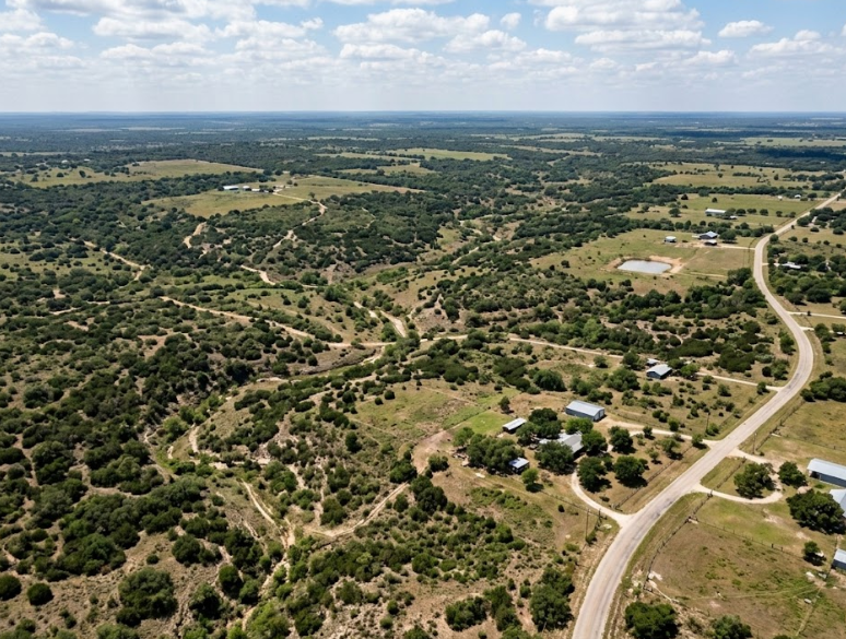 aerial view of rural land parcels and roads showing property boundaries relevant to a land surveying services quote