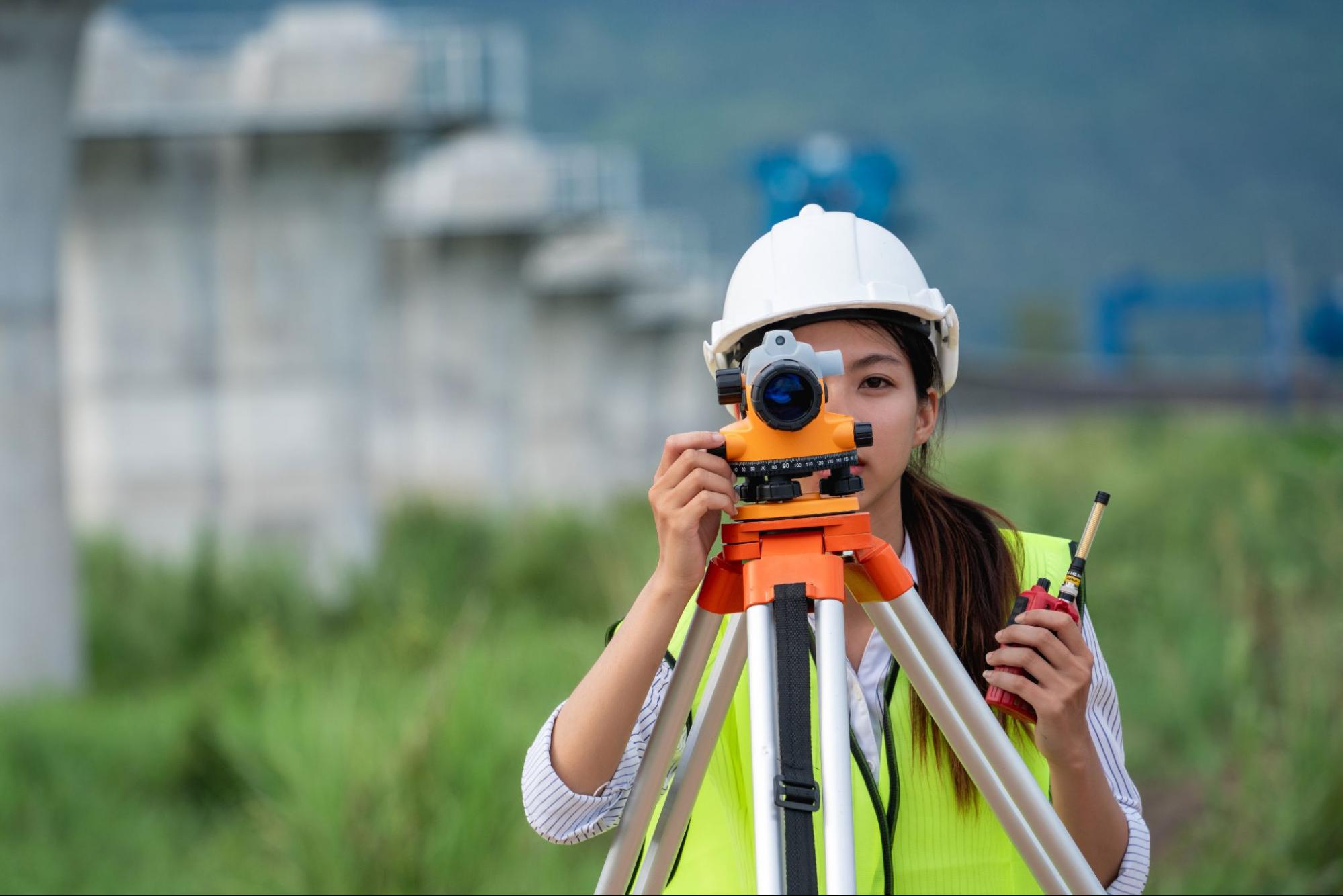 professional using land surveying equipment