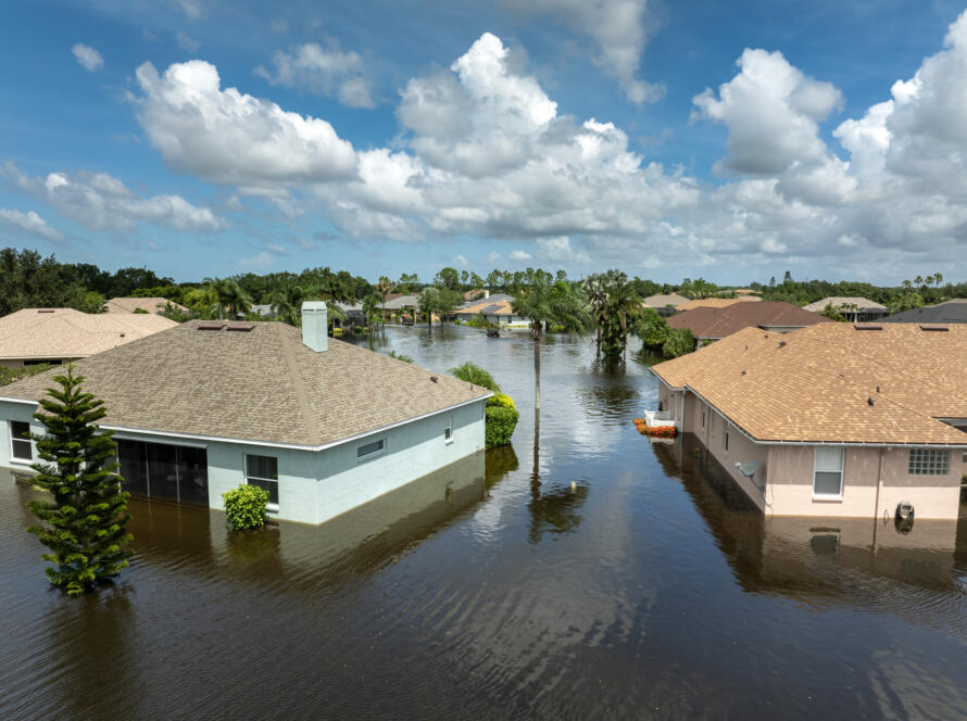 flooded homes in a suburban neighborhood