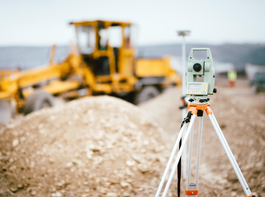 Surveyor equipment GPS system or theodolite outdoors at highway construction site. Surveyor engineering with total station, representing Southpoint Geodetics Address