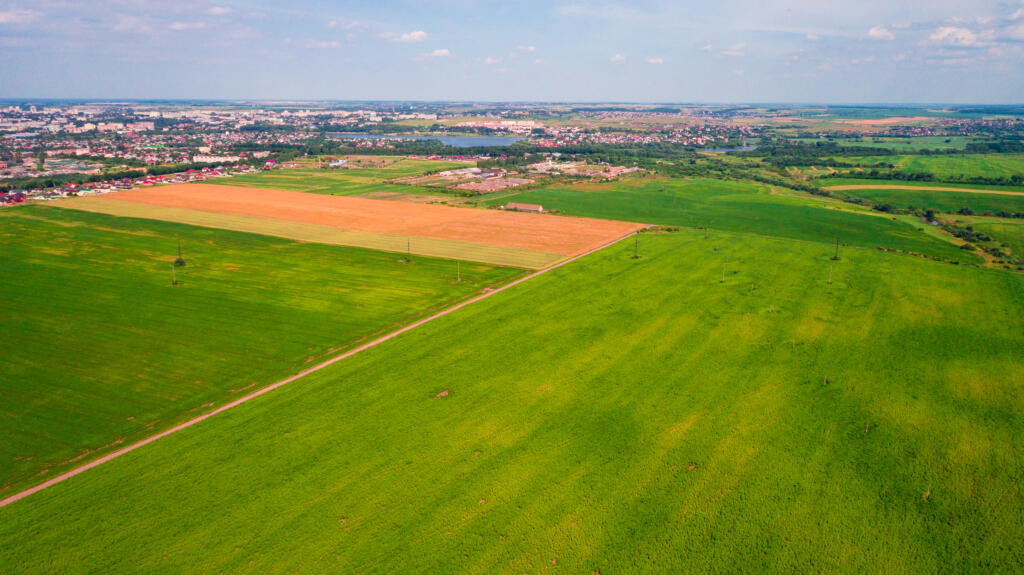 aerial view of green field, representing Experienced Land Survey Services in South Texas