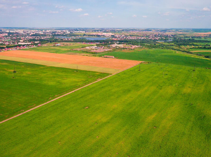 aerial view of green field, representing Experienced Land Survey Services in South Texas