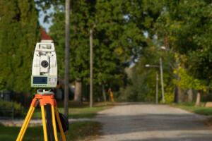 theodolite representing the curiosity behind the question “Do I Need Land Surveying Services to Buy Property in Texas?”