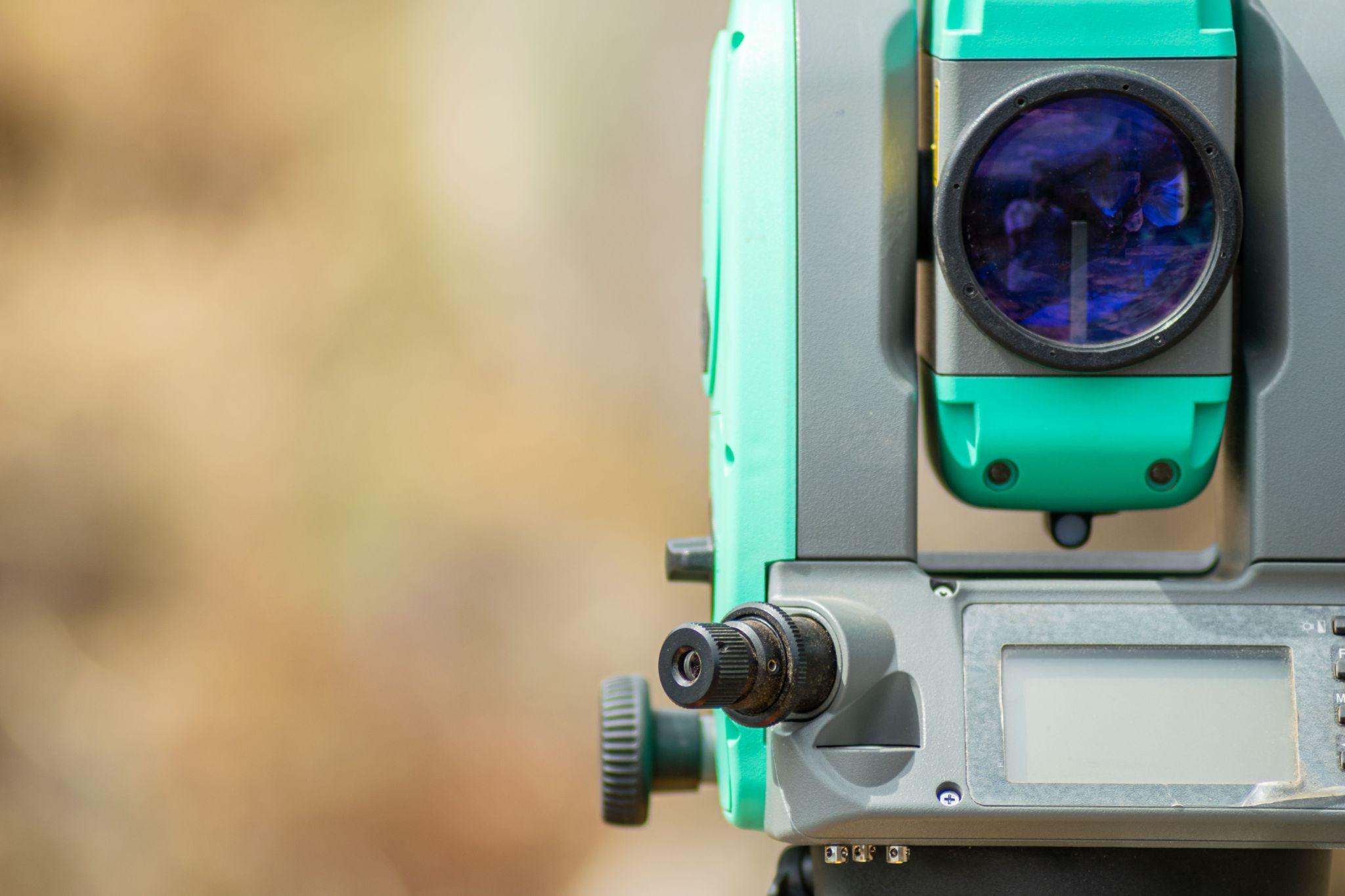 Close-up of a precision surveying instrument used for property measurements