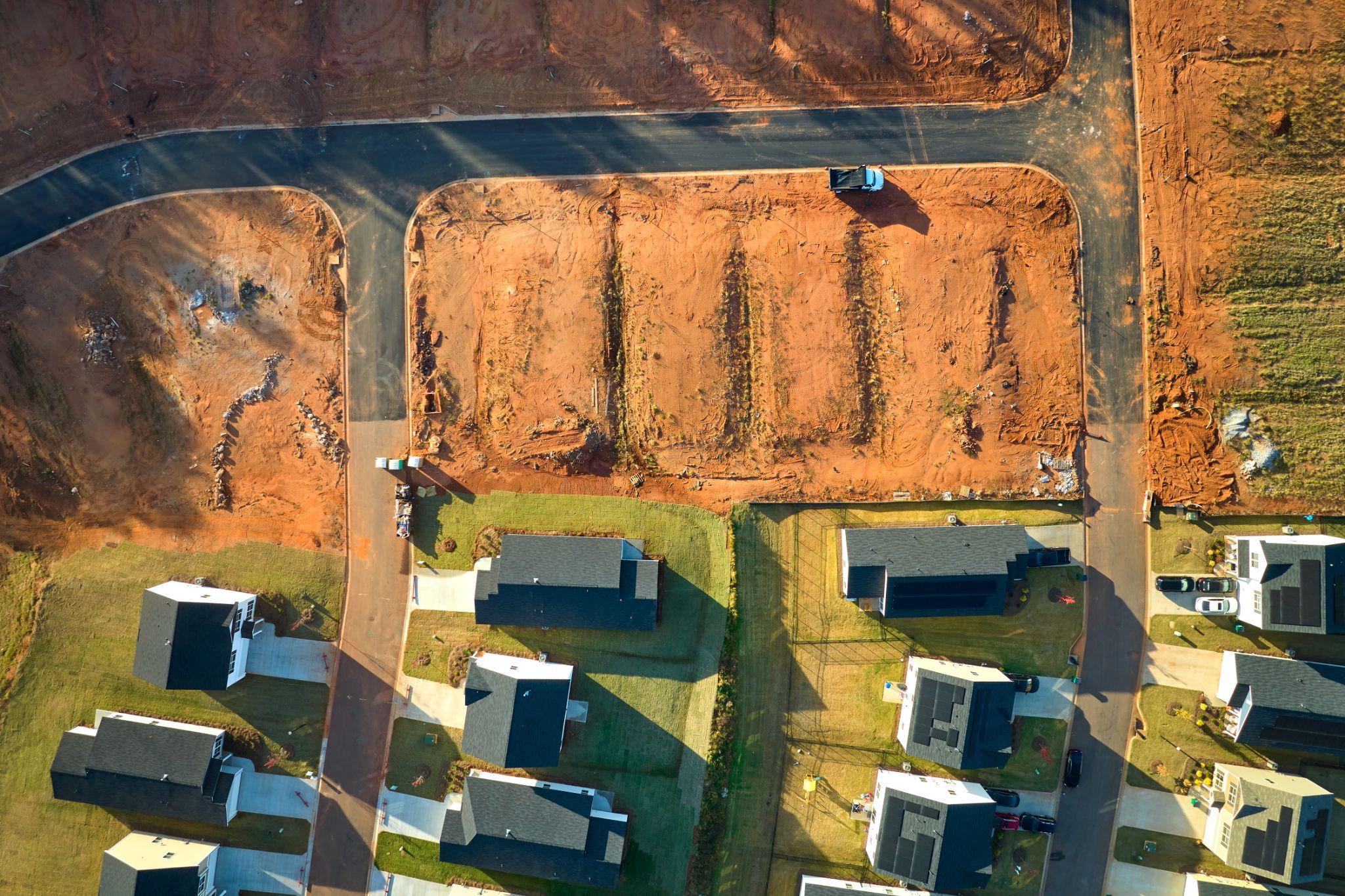 Aerial view of residential lots and roads in a developing subdivision